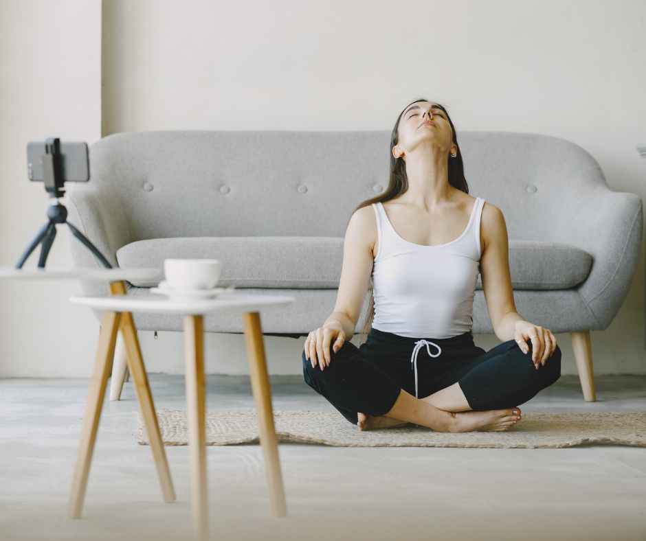 Busy mom doing a quick morning stretch at home while her child plays nearby — promoting 10-minute wellness habits for moms