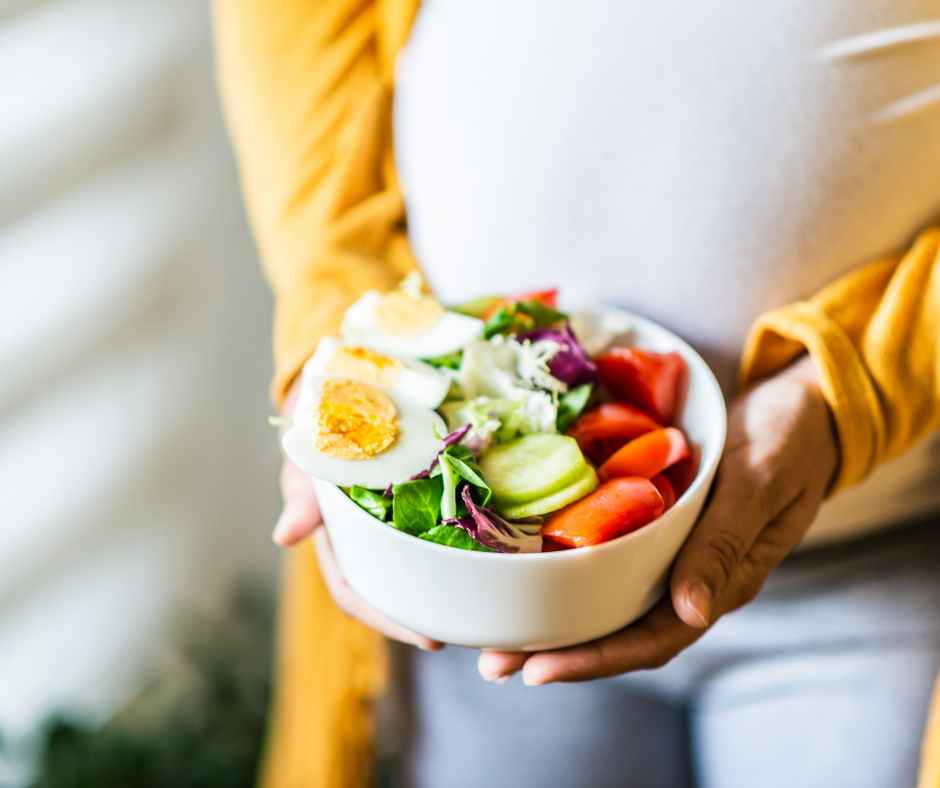 Pregnant woman choosing healthy foods rich in essential nutrients