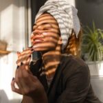 Mom taking a short self-care break at home—drinking water, journaling, or enjoying a quiet moment