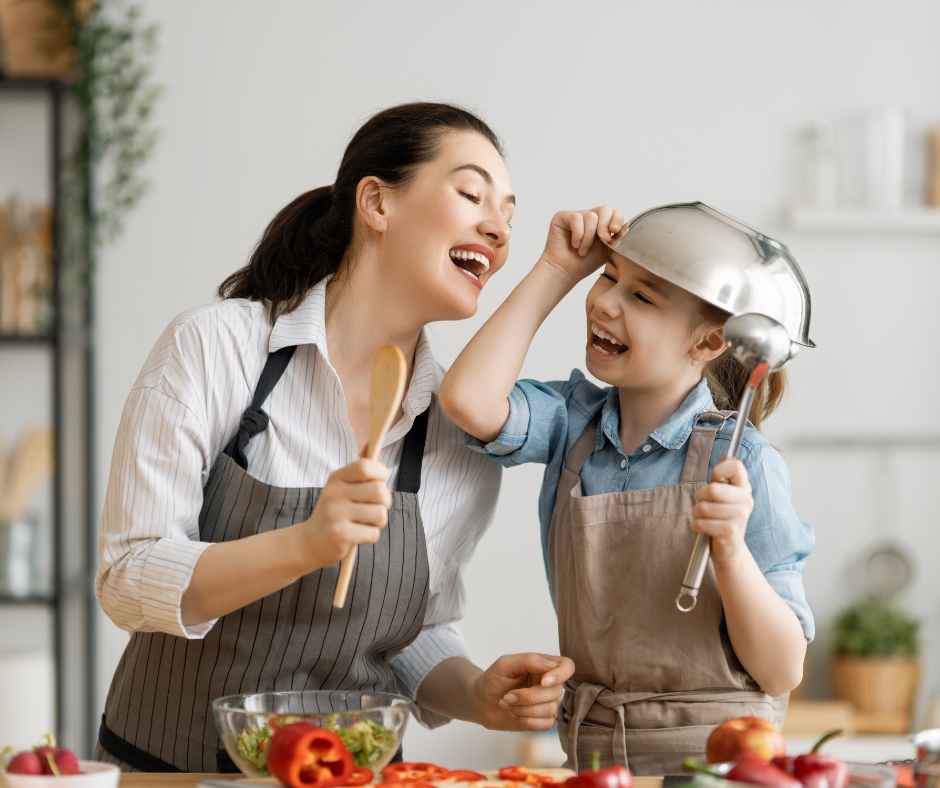 Meal planning for busy moms shown by a mother organizing healthy ingredients and prepping meals for her young child.