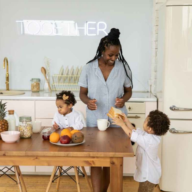 A bowl of colorful fruits, yogurt, and nuts prepared as an immune-boosting snack for kids.